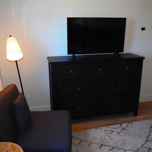 Bedroom #3:  features a queen-on-queen bunk bed, two cozy chairs that fold out into beds, a dresser, closet, and its own private television.