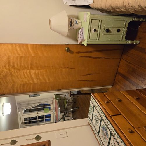 Bedroom #2:  features a full-size bed, nightstand, lamp, and dresser.