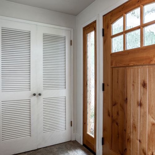Entryway with plenty of closet space.