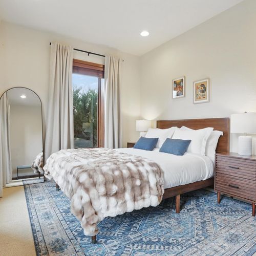 Soothing colors, soft sheets, and a queen size bed for comfort.