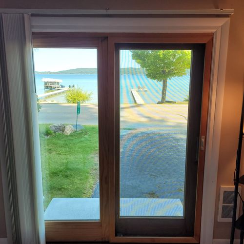 BEDROOM #2 (FIRST FLOOR):  Features a full-size bed, desk, streaming television, closet, private entrance, and a great view of Crystal Lake!