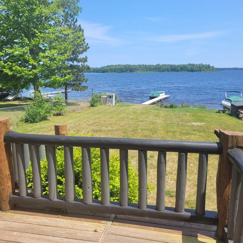 Overall:  the view of van etten lake from the back porch, the boat is not for guest use