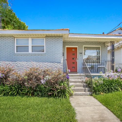 Welcome to your charming New Orleans retreat! This beautifully maintained home features a welcoming front porch and vibrant landscaping, perfect for soaking up the local vibes before you explore the city's vibrant culture.