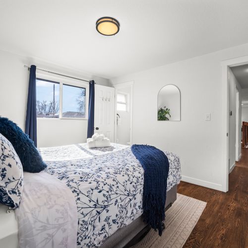 Private bedroom retreat featuring clean design and comfortable sleeping space.