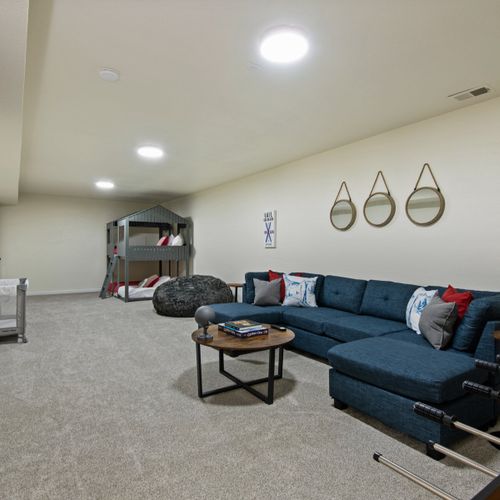 Unwind and enjoy quality entertainment in our cozy downstairs living area, complete with a widescreen tv for your enjoyment.