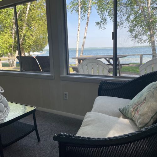 Porch:  the cottage has a beautiful enclosed porch with comfy seating and great views of the lake!
