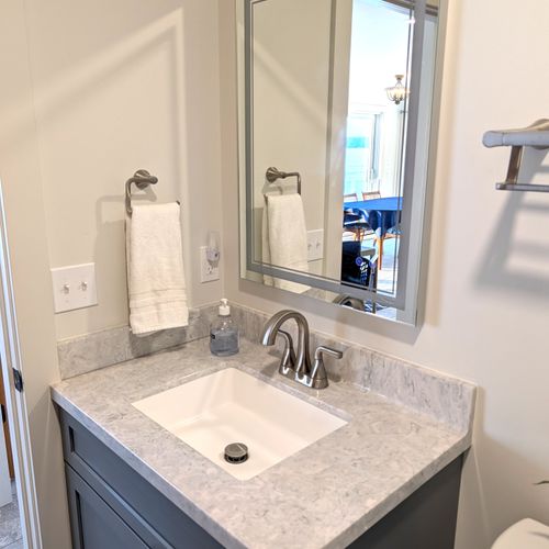 BATHROOM #1 (MAIN FLOOR):  Full bathroom on the main floor with a walk-in shower.