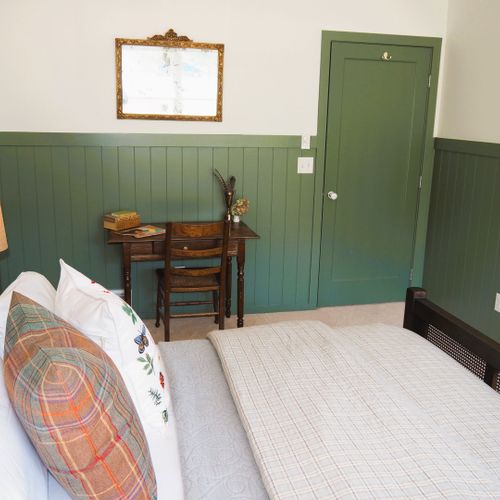 Bedroom #4 (second floor):  features a queen-size bed, closet, and desk.