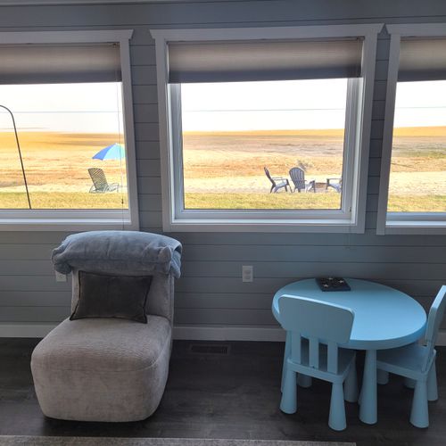 SUNROOM:  The home has a very fun and family-friendly sunroom off of the living room.  It features great views of Lake Huron.