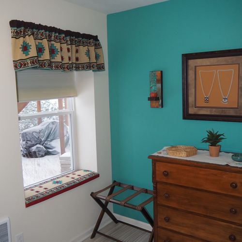 Bedroom:  very comfortable bedroom with a queen-size bed, ceiling fan, dresser, and mirror.