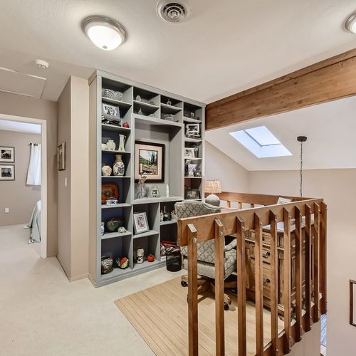 Bonus - there is a space on the top floor that may be referred to as 'an office. ' located at the landing on top of the stairs, this enormous desk and comfortable swivel office provides a great space in which to get some work done.
