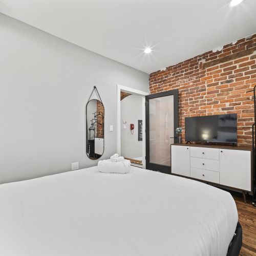 Secondary bedroom offers a full mirror and tidy storage space.