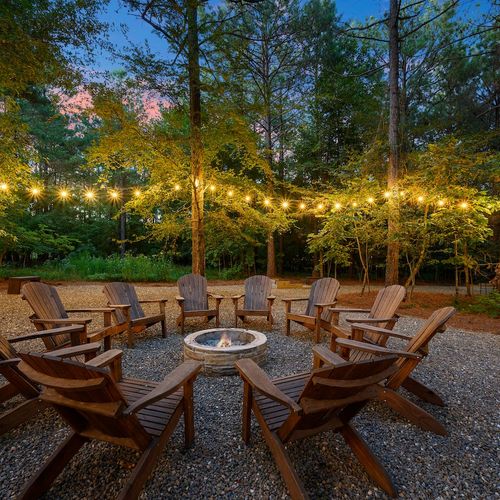 The fire pit is surrounded by chairs perfect for s'mores!
