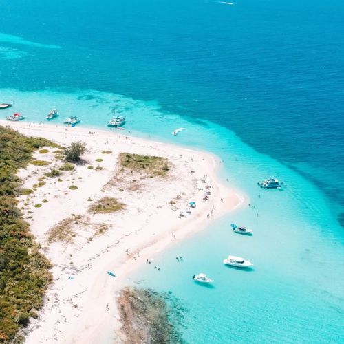 Your luxury island retreat awaits! Indulge in the serene beauty of vibrant blue waters, secluded beaches, and leisurely boat days.