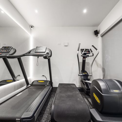 Modern gym with a minimalist design, perfect for a focused workout.