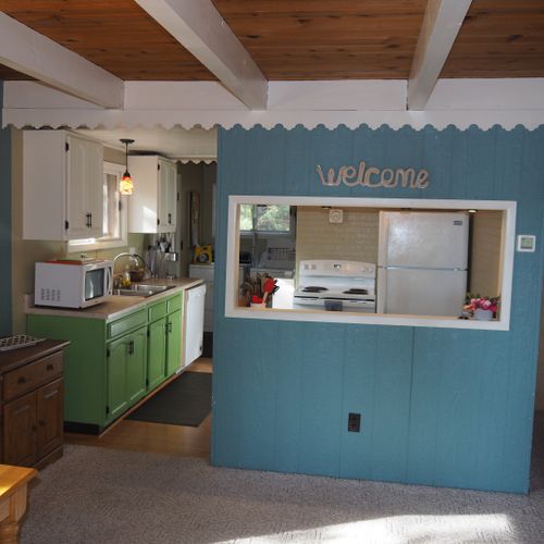 Overall:  looking into the kitchen, which includes all appliances including a dishwasher.
