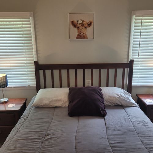 BEDROOM #1:   Master bedroom with a queen-size bed, walk-in closet, private en suite full bathroom, and streaming television.