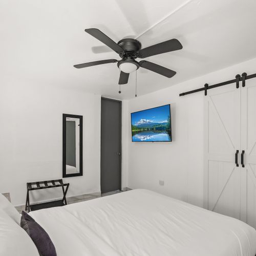 Well-appointed bedroom with bedside tables.
