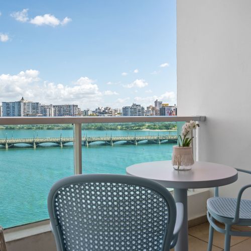 Dine al fresco! Private balcony with dining set and stunning water views. Unforgettable!