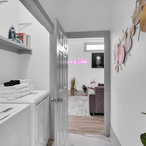 Laundry area w/ washer & dryer tucked neatly for easy, convenient access.