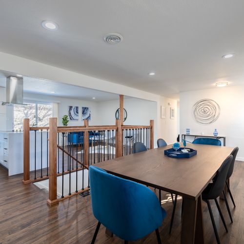 The stairwell leads down to the spacious basement, which includes two bedrooms, game room, and more living space.