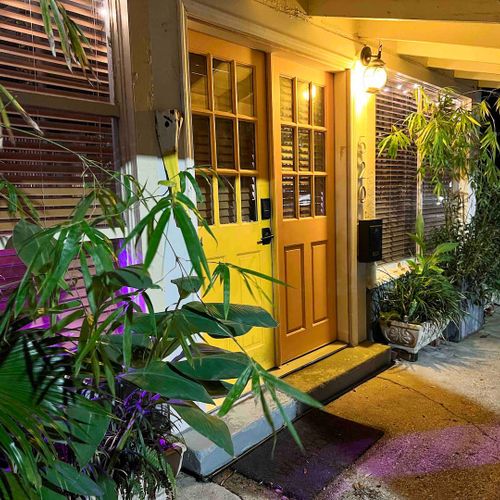 Warmly lit entrance w/ golden doors — welcoming you back no matter the hour.