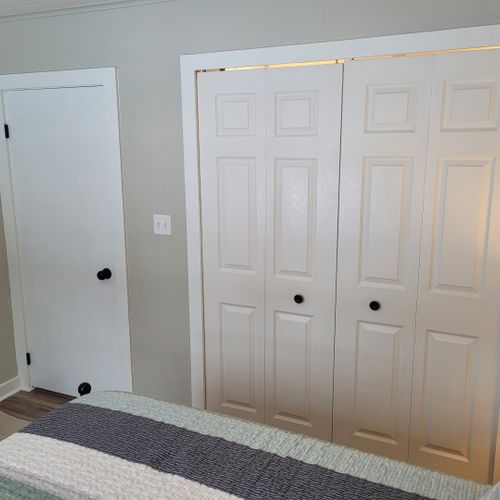 Bedroom #2:  features a queen-size bed, ceiling fan, nightstand, lamp, large closet, and 2 chairs.