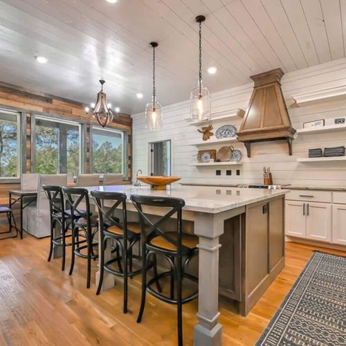 The kitchen and dining area combined have seats for 12.
