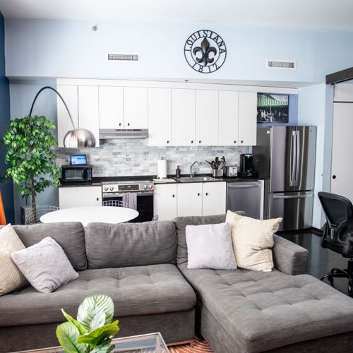 Bright, open-concept kitchen & living area made for cooking, lounging & gathering.