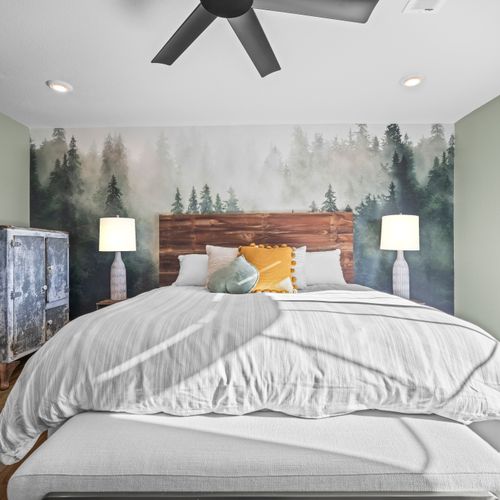 Relax in this serene bedroom retreat with soft linens and thoughtful design details.