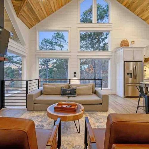 Oversized luxury couch seamlessly transitions into the kitchen.