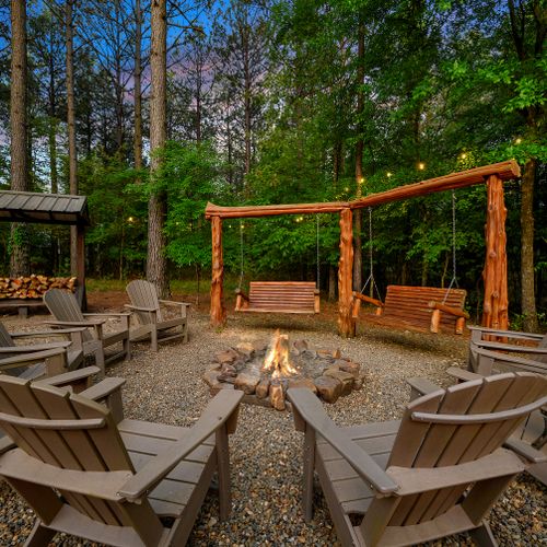 Fire pit with Adirondack chairs and custom swings!