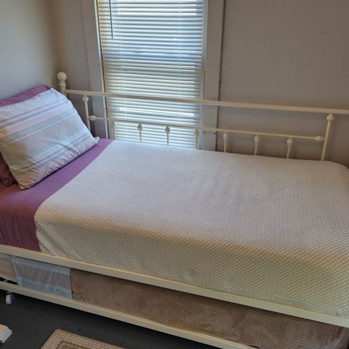 BEDROOM #4 (SECOND FLOOR):  Features a trundle bed (twin bed with a second twin bed that rolls up under it when not in use), lakeview, nightstand, and a closet.