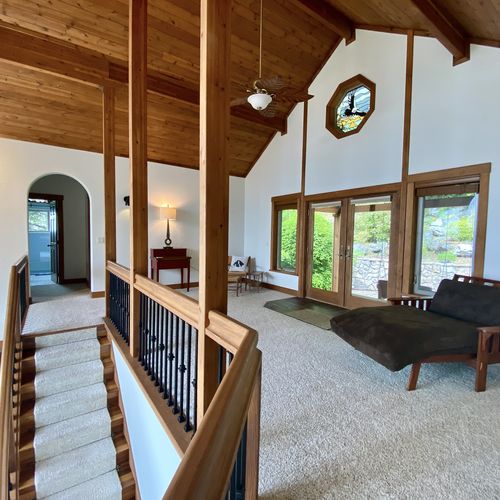 A large loft area for reading, yoga, remote work. Outdoor seating and terraced rock gardens are just outside.