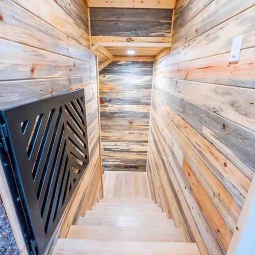 Downstairs to the bottom floor where the game room and 3 bedrooms are housed.