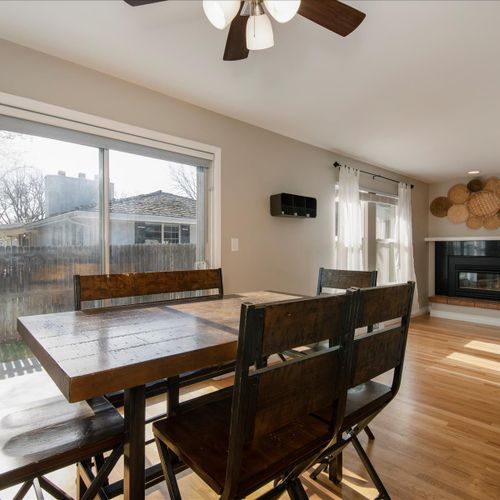 The formal dining room flows effortlessly into the living area.