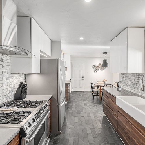 Enjoy the convenience of this well-appointed galley kitchen, featuring stainless steel appliances and ample counter space for all your culinary needs.