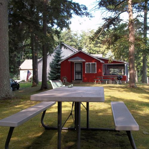 Exterior:  the picnic table for the cabin with the cabin in the background