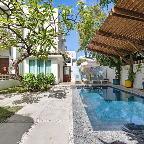 Private pool paradise with a stylish pergola, perfect for sunny days and cool dips.