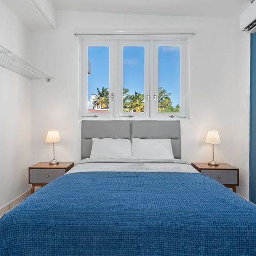 Modern renovated bedroom, huge double bed, soft bedding, bright, window views, airconditioner, modern table lamps