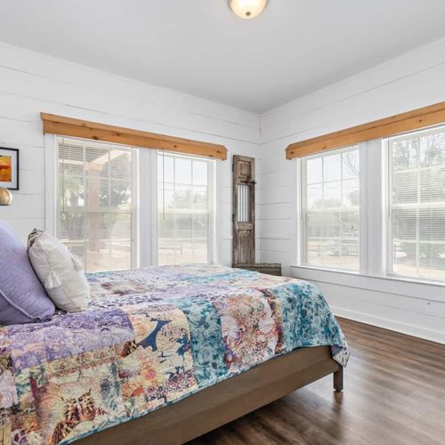 Queen Bed in Bedroom #1 of the main house with a dressing station
