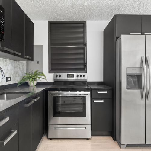 A bright and sleek kitchen with modern appliances.