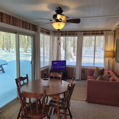Dining area:  the new section of the cabin also includes a circular dining table with seating for 4 adults.