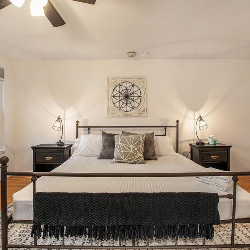 Experience the best of suburbia in this lovely master bedroom with private ensuite bath fitted with a vintage clawfoot soaking tub.