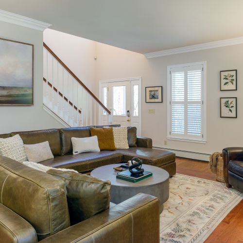 Comfortable seating with large plantation shutters for sunlight and views to the forest and sunsets.