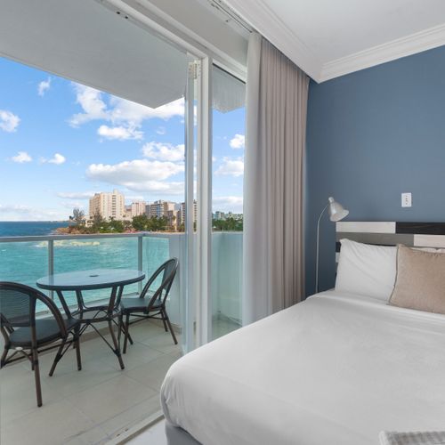 Wake up to breathtaking ocean views from your private balcony, offering a serene escape just steps from your comfortable bed.