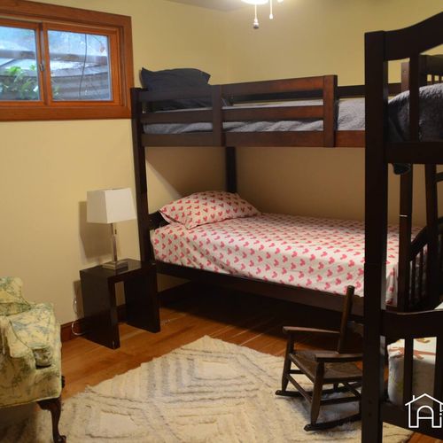 For families or larger groups, bedroom 3 located on the lower floor is the perfect space. The room is thoughtfully designed with plenty of space to move around and store belongings.