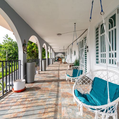 A patio with lush greenery, ideal for relaxing in the fresh air.