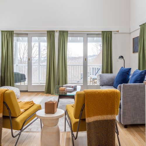 Step out onto the screened in porch from the guest house living room.