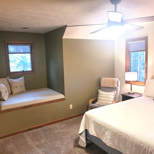 BEDROOM #2 (SECOND FLOOR):  Super cute bedroom with a queen-size bed, ceiling fan, cubby area, closet, dresser, and mirror.